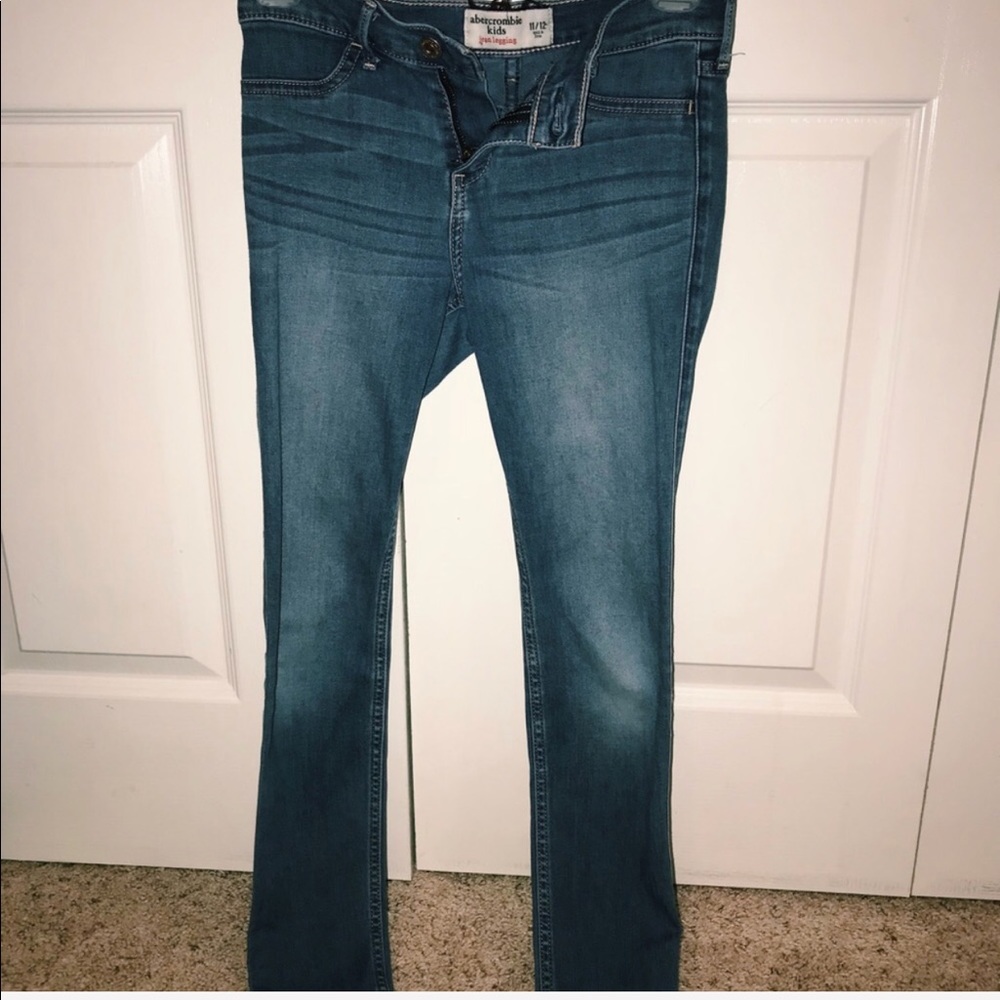 well fitted dark blue jeans